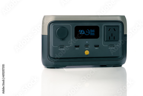 Portable power station or power box isolated on white background. On-the-Go energy solution. Power supply for outdoor adventure. Compact portable power box with a rechargeable lithium-ion battery. photo