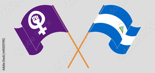 Crossed and waving flags of Feminism and Nicaragua