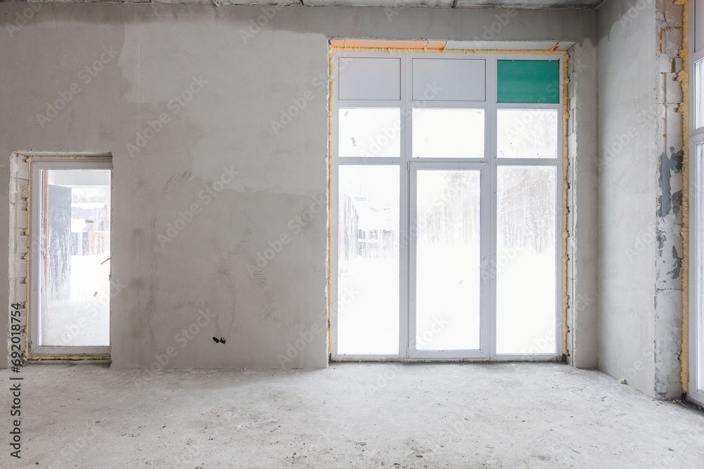 interior of the apartment without decoration in gray colors. rough finish interior of the apartment without decoration in gray colors. rough finish