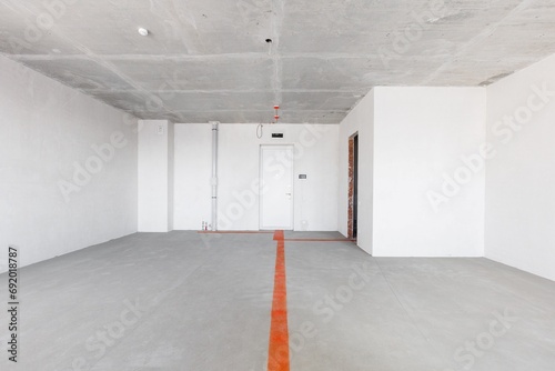 interior of the apartment without decoration in gray colors. rough finish