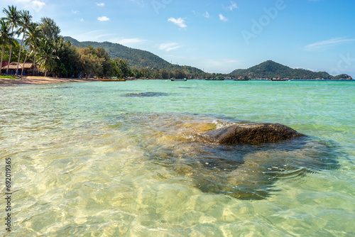 Fototapeta Naklejka Na Ścianę i Meble -  Seascape with stone in clear transparent turquoise sea water on tropical beach on Koh Tao island