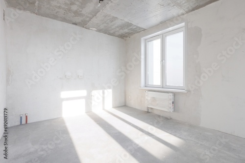 interior of the apartment without decoration in gray colors. rough finish © gluschenkoart