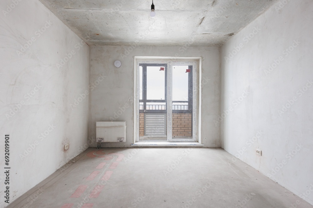 interior of the apartment without decoration in gray colors. rough finish interior of the apartment without decoration in gray colors. rough finish