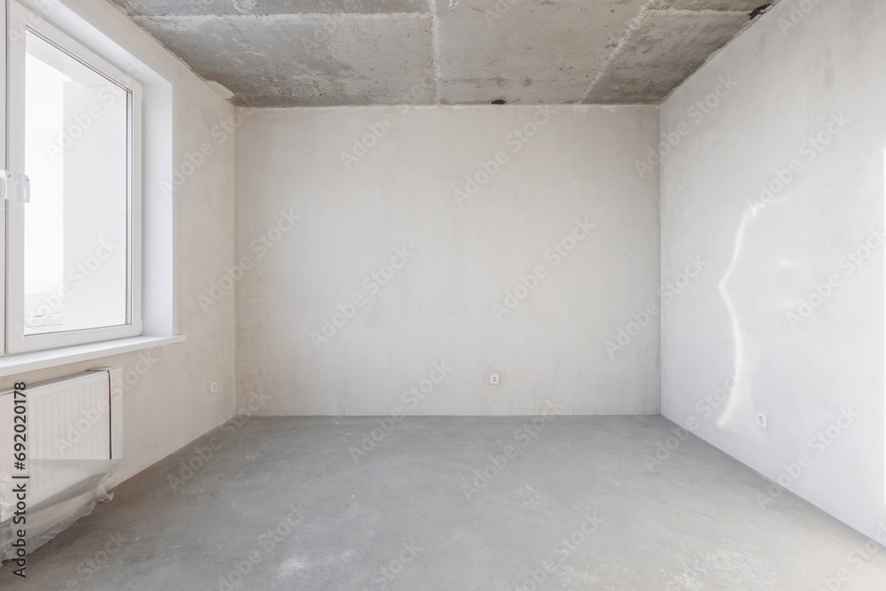 interior of the apartment without decoration in gray colors. rough finish interior of the apartment without decoration in gray colors. rough finish