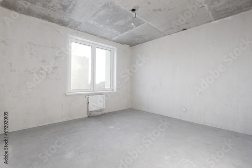 interior of the apartment without decoration in gray colors. rough finish