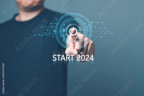 Man point to computer user interfaces. 2024 trend, Plan to accelerate enterprise market growth and expansion, Concept start 2024 Business Planning and goal, New Technology. photo