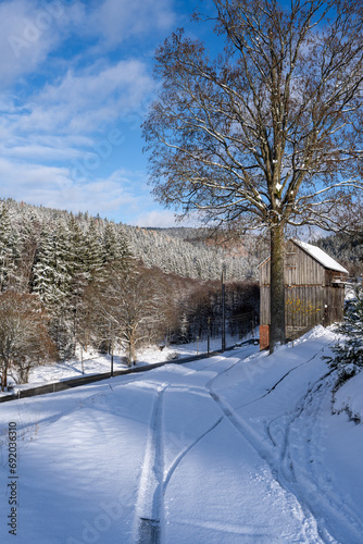 Winterlandschaft mit alter Holzhütte  photo