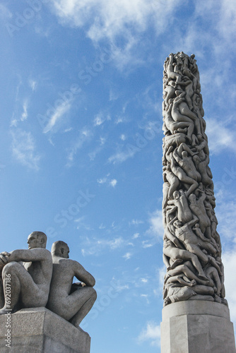 monument to the discoveries in nordic style architecture with human figures in different positions and monolite 