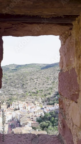 The anThe ancient town of Vilafames in Spain in winter. Beautiful architecture of stone houses on the rocks. Castle on top of a hill. Popular tourism destination in the province of Castellon photo