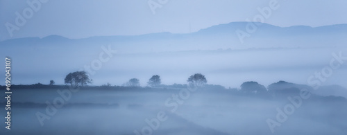 Misty rural scene panorama near Ladock cornwall uk  photo