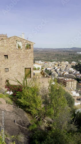 The anThe ancient town of Vilafames in Spain in winter. Beautiful architecture of stone houses on the rocks. Castle on top of a hill. Popular tourism destination in the province of Castellon photo