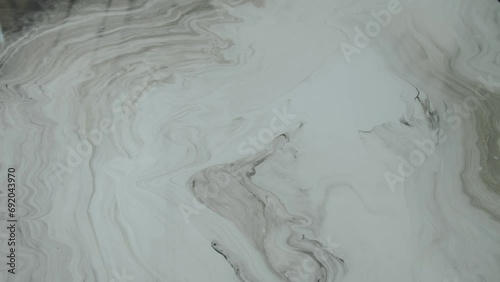 Close-up marble surface of the tabletop in the luxury kitchen. Top view of white marble texture and zoom in camera, slow motion.