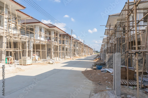construction residential new house in progress at building site housing estate development © Kwangmoozaa