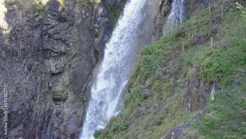 Waterfall Reichenbach falls flowing in Rosenlaui Gletscherschlucht at Berner Oberland, Switzerland photo