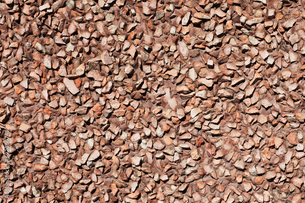 Red gravel texture. Small rocks grain pattern for graphic design. Little stones background. Gray noise backdrop. Stone facade texture. Red gravel texture. Small rocks grain pattern for graphic design. Little stones background. Gray noise backdrop. Stone facade texture.