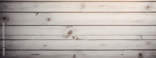 Old dark gray wood wall for wood background and texture. An old weathered wooden wall with a white paint striped pattern creates a rustic backdrop for your next design project.