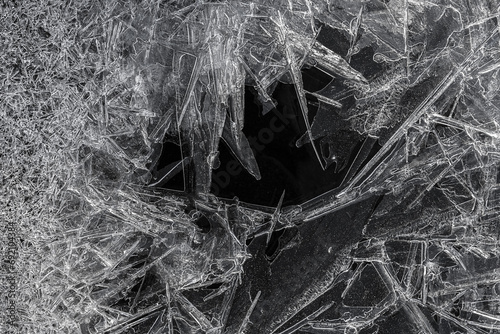 Intricate ice crystal formation with dark background photo