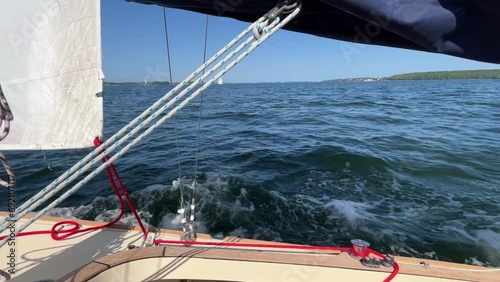 Sideways view from a sailing boat sailing on choppy sea on the Baltic Sea