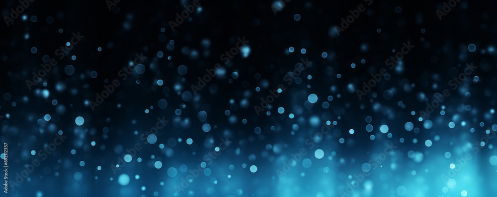 Blue motes of light in a colored glowing abstract gradient for banner copy space, digital material texture on black background