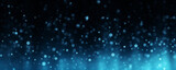 Blue motes of light in a colored glowing abstract gradient for banner copy space, digital material texture on black background