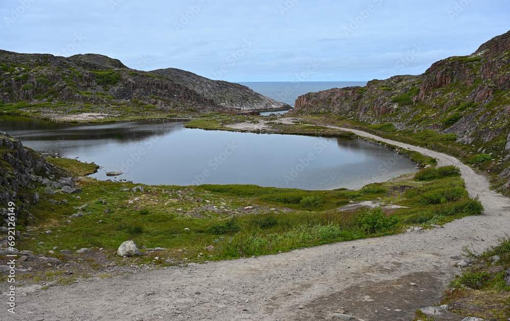 Northern landscape of lakes and tundra with a rear view of the Barents Sea Northern landscape of lakes and tundra with a rear view of the Barents Sea