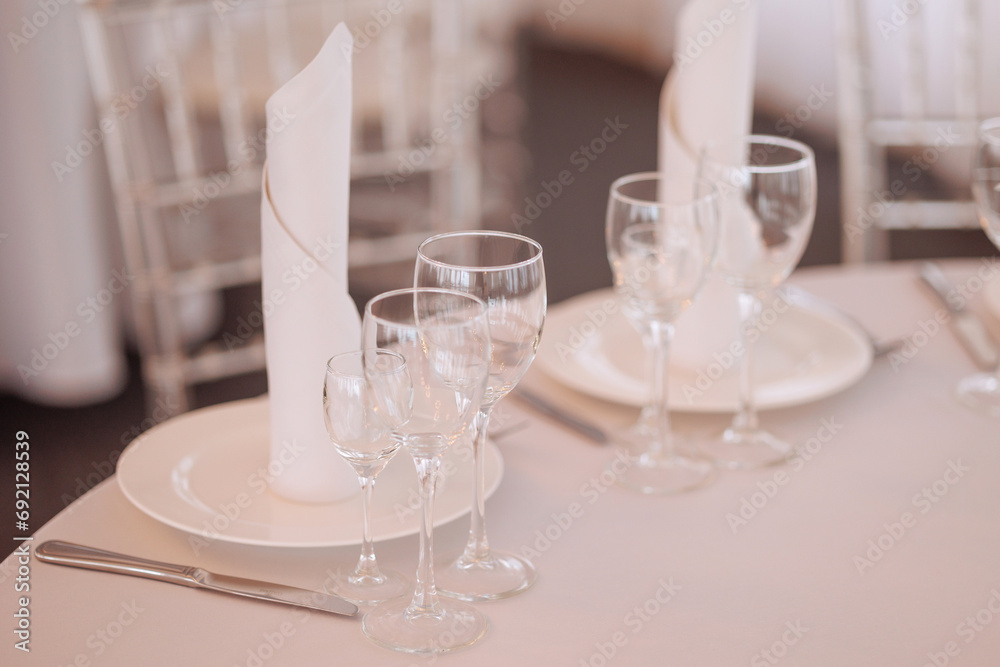 Three empty glasses for alcoholic beverages of vodka, wine and champagne are on the table. High quality photo Three empty glasses for alcoholic beverages of vodka, wine and champagne are on the table. High quality photo