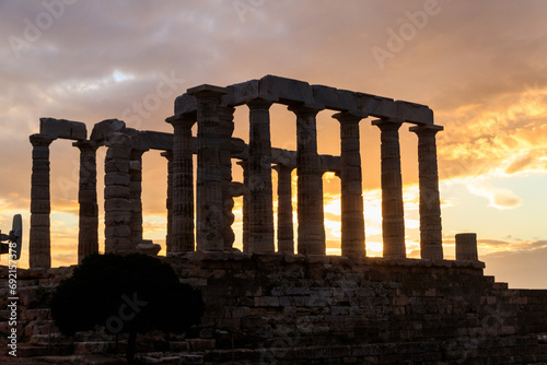 Greece Cape Sounio. Ruins of an ancient temple of Poseidon, Greek god of the sea, on sunset.Tourist landmark of Attica, Sounion, Greece