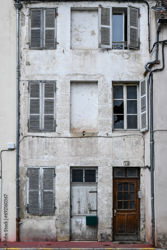 Weathered and old windows and door of ancient buildings in the old city