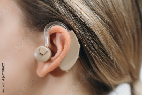 The hearing aid in the girl's ear