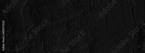 Old black concrete wall grungy texture background. Chalkboard texture concrete cement.