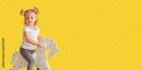 Adorable baby girl with roc...