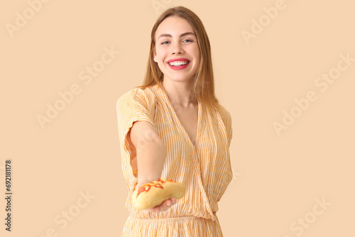 Pretty young woman with tas...