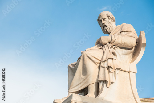 Statue of Plato from the Academy of Athens, Greece against blue sky. Popular Greek landmark and travel destination