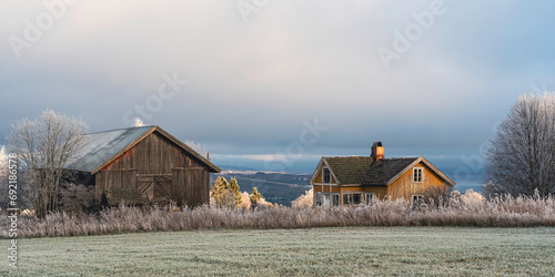 Abandoned farm in hoarfrost. photo