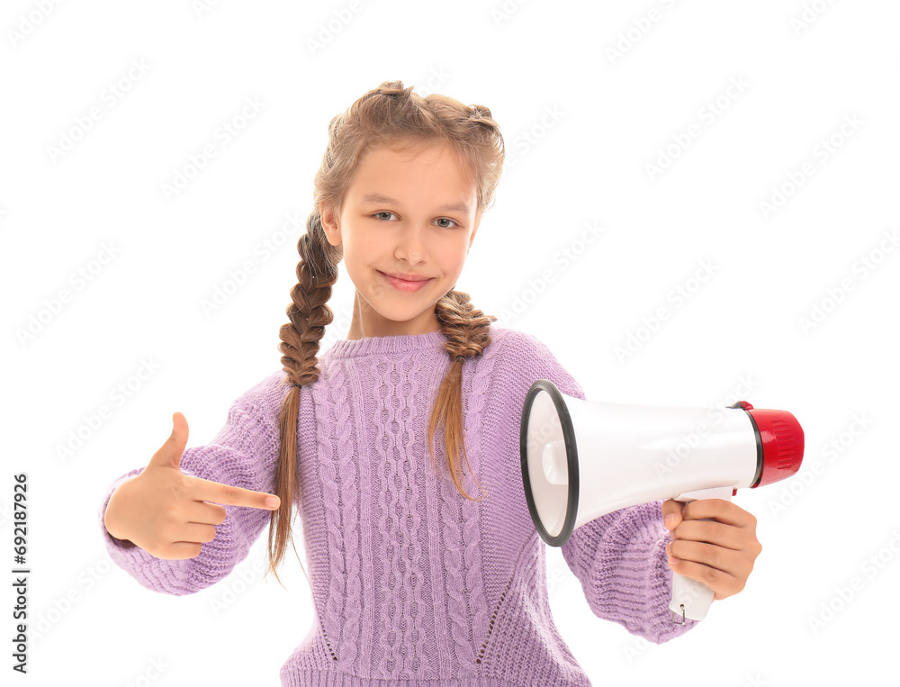 Naklejka premium Little girl pointing at megaphone on white background