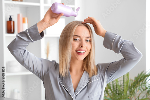 Young blonde woman applying...