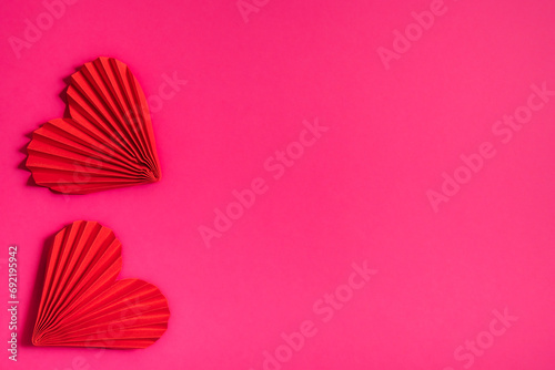 Two beautiful hearts on a pink background  symbol of love  happy woman  mother  Valentine s Day  greeting card design.