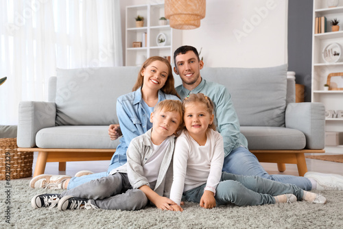 Little children with their parents sitting at home