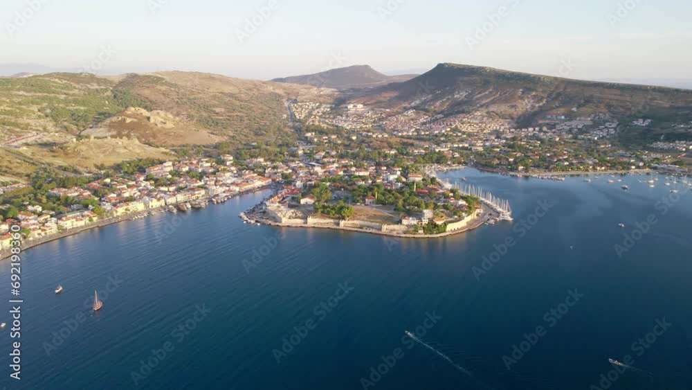 Aerial wide shot of Foca resort town with touristic street on sea bay, Izmir region Turkey Aerial wide shot of Foca resort town with touristic street on sea bay, Izmir region Turkey