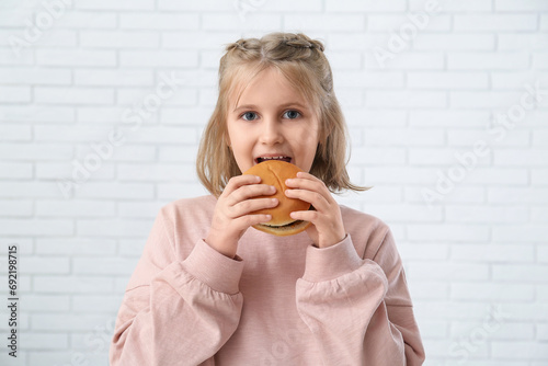 Cute little girl with burge...
