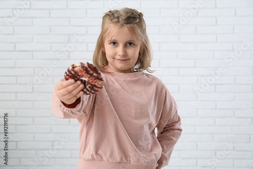 Cute little girl with donut...