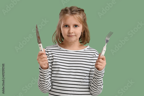Cute little girl with fork ...