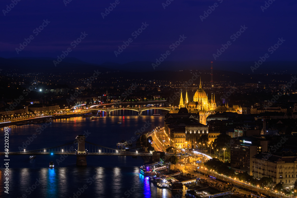 Picturesque evening Budapest  cityscape at blue hour with illuminated Chain Bridge and Hungarian Parliament on Danube River.