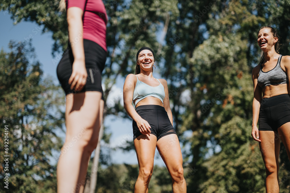 Active Sports People Enjoying Outdoor Activities in a City Park. They Are Having a Fun Conversation and Laughing. Active Sports People Enjoying Outdoor Activities in a City Park. They Are Having a Fun Conversation and Laughing.
