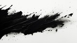Black paint splattered on a white surface. Suitable for art, design, and creative projects