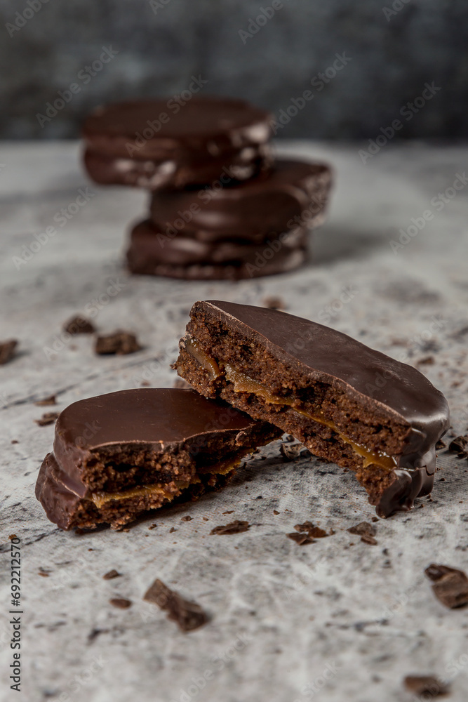 chocolate and dulce de leche alfajor gray background chocolate and dulce de leche alfajor gray background