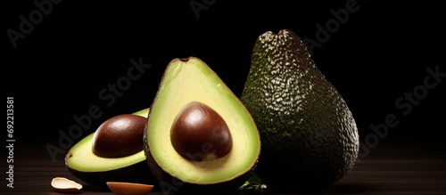 Aguacate Criollo Home harvest of criollo avocado this variety is the ancestor of the domesticated varieties that we know today they are small with thin black skin and large seed. Copy space image photo