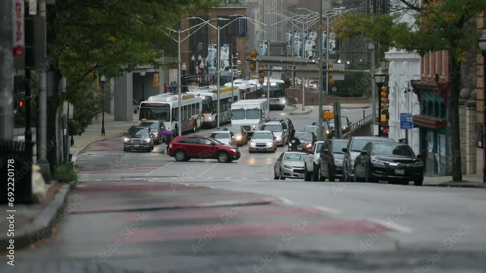 Baltimore Traffic and MTA Bus in Background. Buses are operated by the Maryland Transit Administration. Maryland State Baltimore Traffic and MTA Bus in Background. Buses are operated by the Maryland Transit Administration. Maryland State