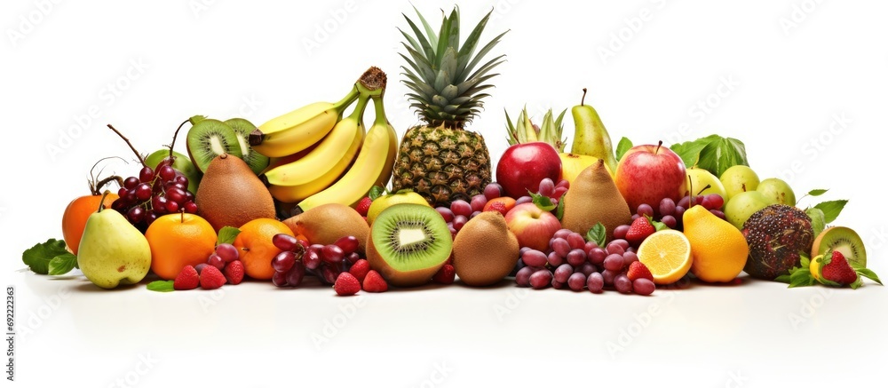 Assortment of exotic fruits in basket isolated on white. Copy space image. Place for adding text or design Assortment of exotic fruits in basket isolated on white. Copy space image. Place for adding text or design