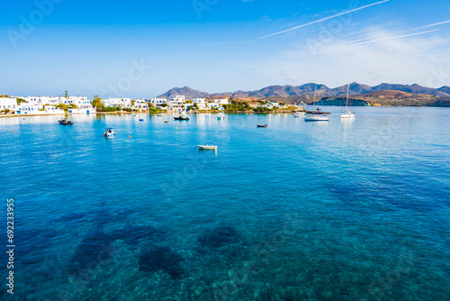 View of sea and Pollonia port houses from deck ferry from Kimolos, Milos island, Cyclades, Greece photo